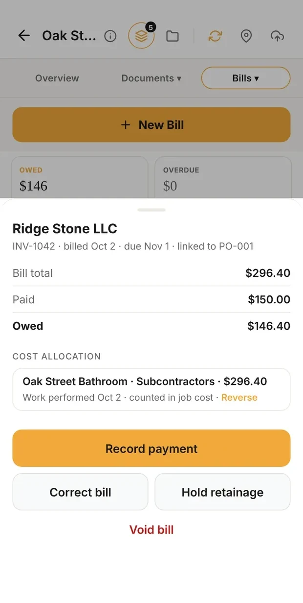 Clamp's bill from Ridge Stone LLC, INV-1042, billed Oct 2, due Nov 1, linked to PO-001: bill total $296.40, paid $150.00, owed $146.40; cost allocation Oak Street Bathroom, Subcontractors, $296.40, work performed Oct 2, counted in job cost