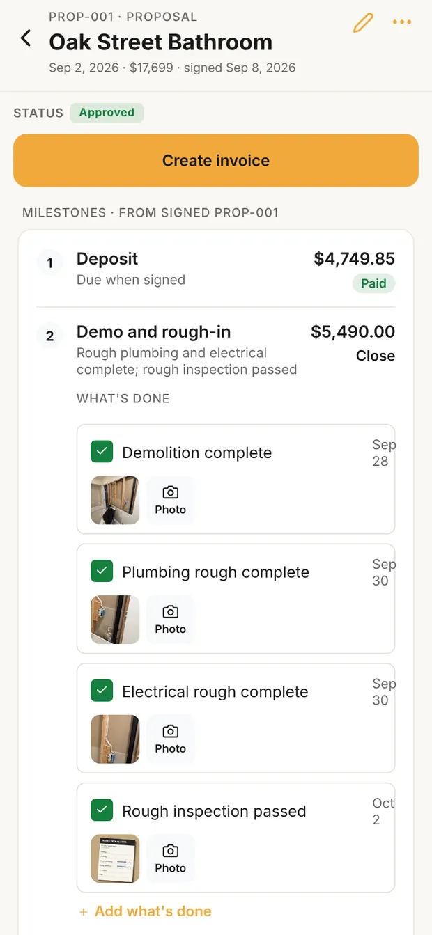 Clamp's milestones for the Oak Street Bathroom from signed PROP-001: the deposit, $4,749.85, paid; Demo and rough-in, $5,490.00, due when rough plumbing and electrical are complete and the rough inspection has passed, open to What's done with four checked lines, each with a photo: demolition complete Sep 28, plumbing rough complete Sep 30, electrical rough complete Sep 30, rough inspection passed Oct 2